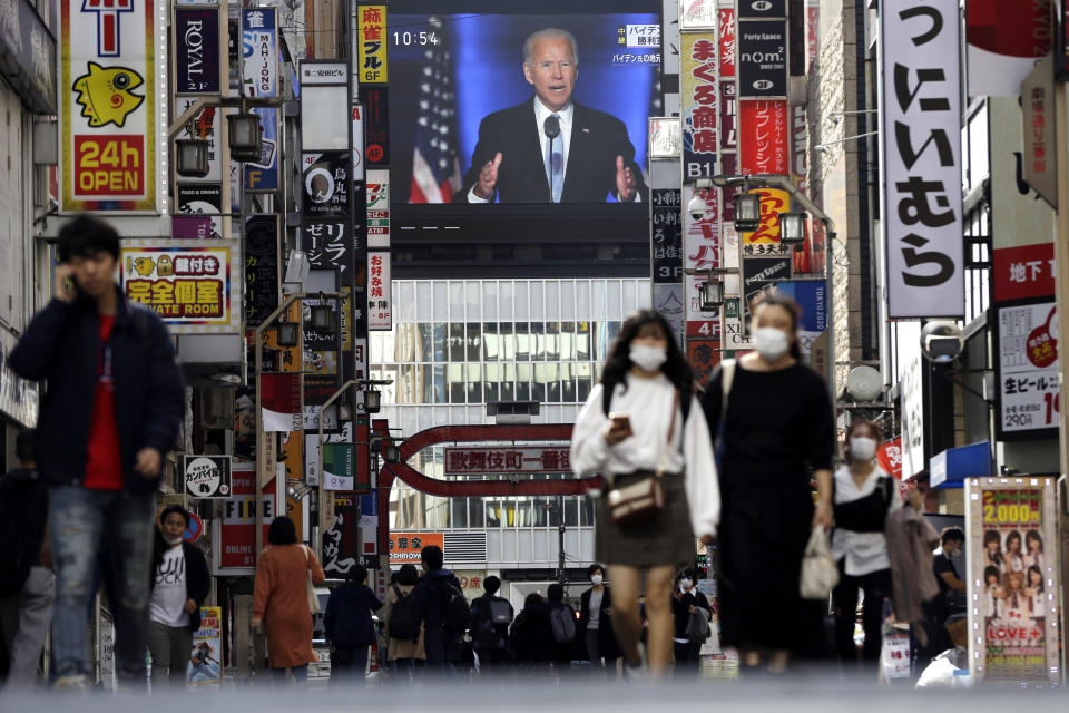 A screen shows a live broadcast of President-elect Joe Biden speaking Sunday, on Sunday, at the Shinjuku shopping district in Tokyo, Japan. Photo: Kiichiro Sato/AP