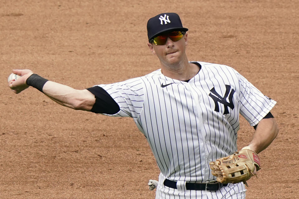 FILE - New York Yankees third baseman DJ LeMahieu throws to first during a baseball game against the Baltimore Orioles at Yankee Stadium in New York, in this Sunday, Sept. 13, 2020, file photo. The New York Yankees and AL batting champion DJ LeMahieu worked Friday, Jan. 15, 2021, to put in place a six-year contract worth about $90 million, a person familiar with the deal told The Associated Press. The person spoke on condition of anonymity because the agreement is subject to a successful physical. (AP Photo/Kathy Willens, File)