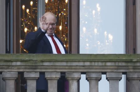 Chief of Staff of the German Chancellery Peter Altmaier is seen on the balcony of German Parliamentary Society offices during the exploratory talks about forming a new coalition government held by CDU/CSU in Berlin, Germany, October 18, 2017. REUTERS/Hannibal Hanschke