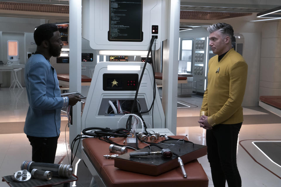 L-R Babs Olusanmokun as Dr. M\'Benga and Anson Mount as Capt. Pike in Star Trek: Strange New Worlds streaming on Paramount+, 2023. Photo Credit: Michael Gibson/Paramount+ 