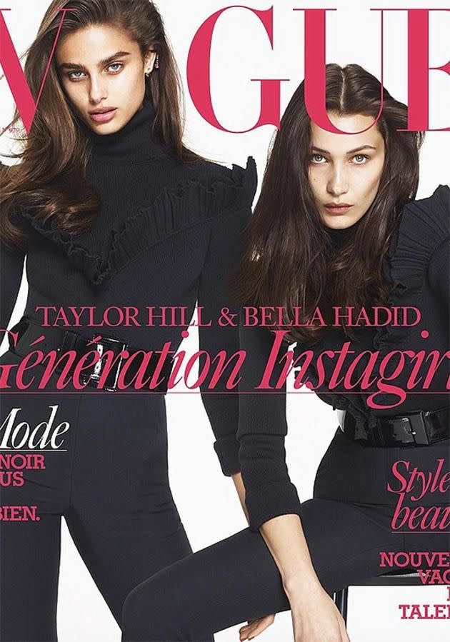Bella looks a lot more covered up on the cover for the glossy magazine alongside fellow model Taylor Hill. Photo: Vogue Paris.