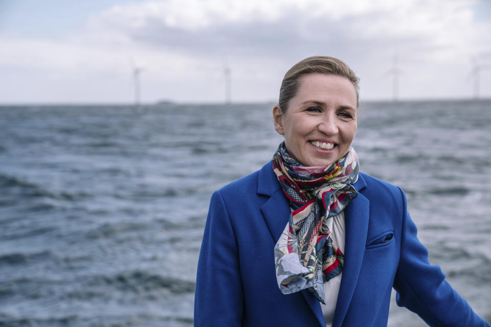 Denmark's Prime Minister Mette Frederiksen views Middelgrund's wind turbines near Copenhagen, Thursday April 22, 2021. President Joe Biden will open a global climate summit, an all-virtual climate summit for 40 world leaders, on Thursday, with a pledge to cut at least in half the climate-wrecking coal and petroleum fumes that the U.S. pumps out. (Emil Helms/Ritzau Scanpix via AP)