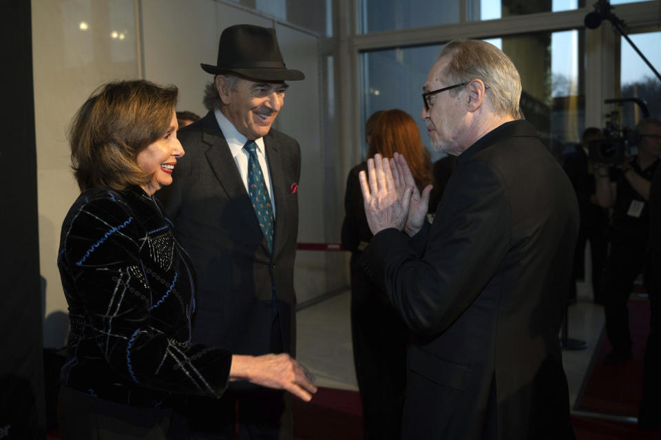 Rep. Nancy Pelosi, D-Calif., left, and her husband Paul Pelosi talk with Steve Buscemi, right, as they arrive on the red carpet for the 24th Annual Mark Twain Prize for American Humor at the Kennedy Center for the Performing Arts on Sunday, March 19, 2023, in Washington. (AP Photo/Kevin Wolf)