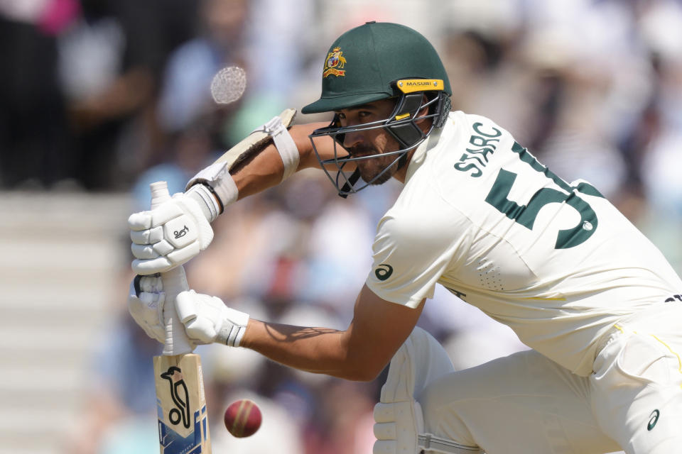 Australia's Mitchell Starc plays a shot on the fourth day of the ICC World Test Championship Final between India and Australia at The Oval cricket ground in London, Saturday, June 10, 2023. (AP Photo/Kirsty Wigglesworth)