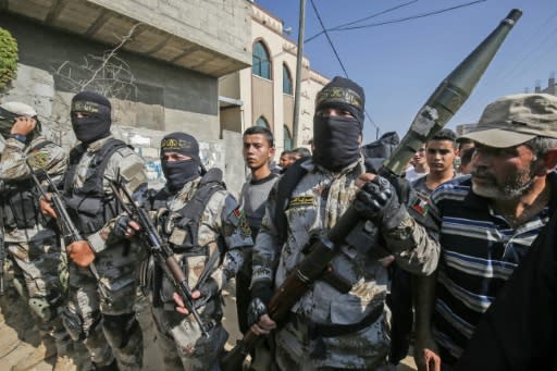 Palestinian Islamic Jihad militants attend the funeral of a comrade in the southern Gaza Strip this week