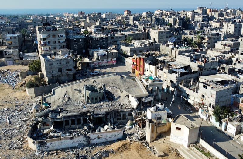 A mosque destroyed in Israeli strikes during the conflict lies in ruin, in Khan Younis