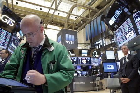 Traders work on the floor of the New York Stock Exchange (NYSE) April 15, 2016. REUTERS/Brendan McDermid