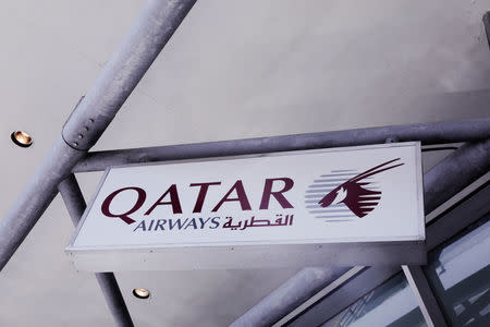 A sign for Qatar airlines hangs at JFK International Airport in New York, U.S., March 21, 2017. REUTERS/Lucas Jackson