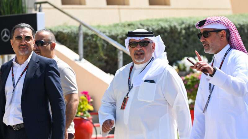 Salman bin Hamad Al Khalifa, the Crown Prince of Bahrain walks with three other men.