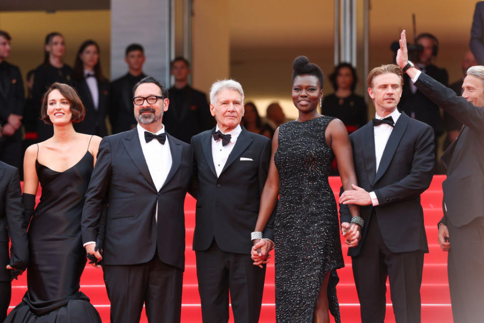 CANNES, FRANCE - MAY 18: (L-R) Phoebe Waller-Bridge, Director James Mangold, Harrison Ford, Shaunette Renée Wilson, Boyd Holbrook and Mads Mikkelsen attend the "Indiana Jones And The Dial Of Destiny" red carpet during the 76th annual Cannes film festival at Palais des Festivals on May 18, 2023 in Cannes, France. (Photo by Vittorio Zunino Celotto/Getty Images)