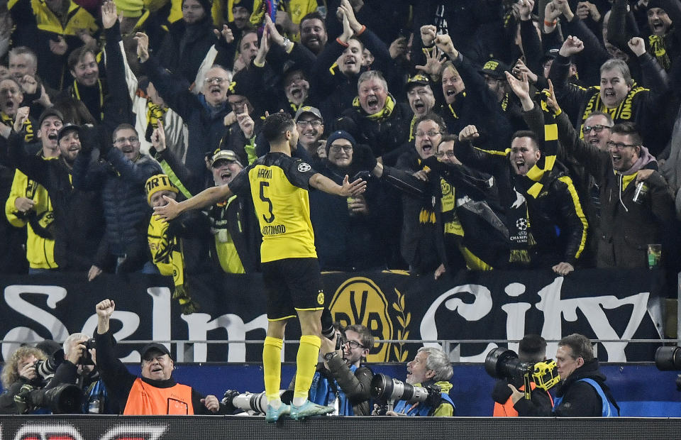 Dortmund's Achraf Hakimi celebrates after scoring his side's third goal during the Champions League group F soccer match between Borussia Dortmund and Inter Milan, in Dortmund, Germany, Tuesday, Nov. 5, 2019. Dortmund defeated Inter with 3-2. (AP Photo/Martin Meissner)