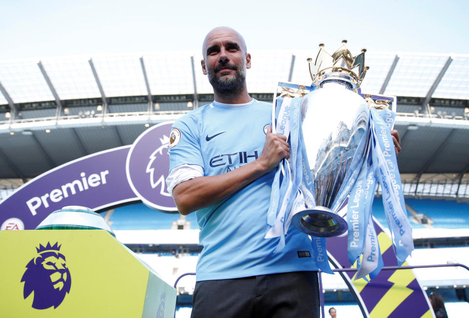 <p>Soccer Football – Premier League – Manchester City vs Huddersfield Town – Etihad Stadium, Manchester, Britain – May 6, 2018 Manchester City manager Pep Guardiola celebrates with the trophy after winning the Premier League title Action Images via Reuters/Carl Recine EDITORIAL USE ONLY. No use with unauthorized audio, video, data, fixture lists, club/league logos or “live” services. Online in-match use limited to 75 images, no video emulation. No use in betting, games or single club/league/player publications. Please contact your account representative for further details. </p>