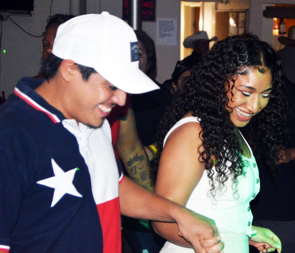 Joab and Dayzha Saldana laugh during a dance at the VFW bingo hall Saturday, Sep. 23, 2023. As many as 80 people attended past dances.