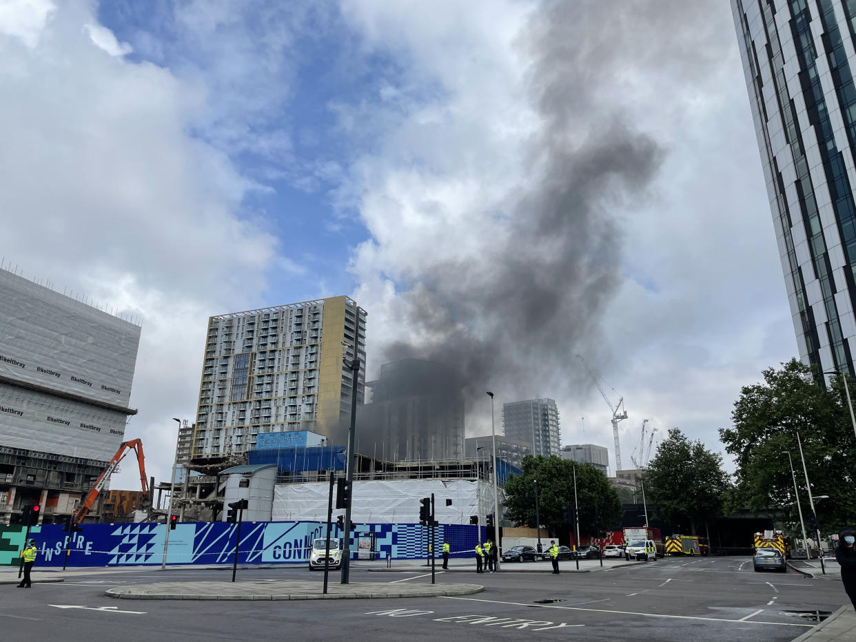 Emergency services at the scene of a fire that has broken out at garages close to Elephant and Castle railway station in London. Issue date: Monday June 28, 2021.