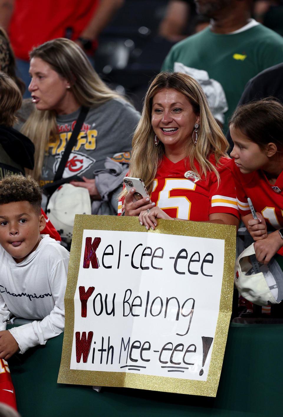 A Kansas City Chiefs fan holds up a sign that reads, 