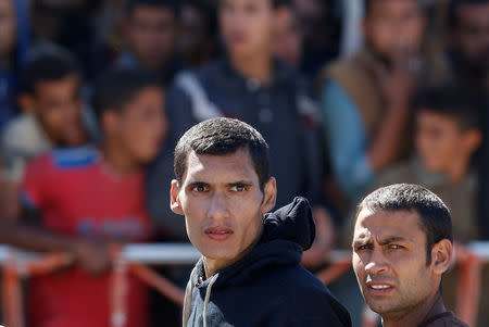 Migrants disembark from the Italian coastguard vessel Peluso in the Sicilian harbour of Augusta, Italy, May 13, 2016. REUTERS/Antonio Parrinello