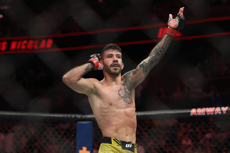 Dec 3, 2022; Orlando, Florida, USA; Matheus Nicolau (red gloves) reacts after fighting Matt Schnell (blue gloves) during UFC Fight Night at Amway Center. Mandatory Credit: Nathan Ray Seebeck-USA TODAY Sports