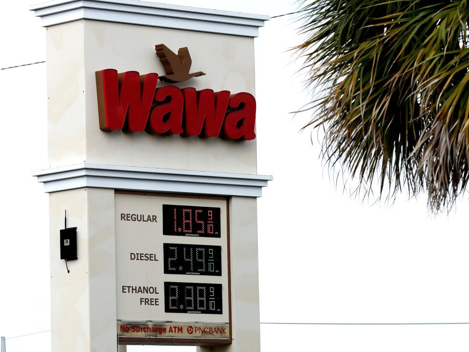 Signs display the price of gasoline on Tuesday, March 31, 2020, in Winter Park, Fla