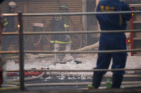 <p>Firefighters operate at the fire site at Tokyo’s Tsukiji fish market in Tokyo, Japan August 3, 2017. (Photo: Toru Hanai/Reuters) </p>