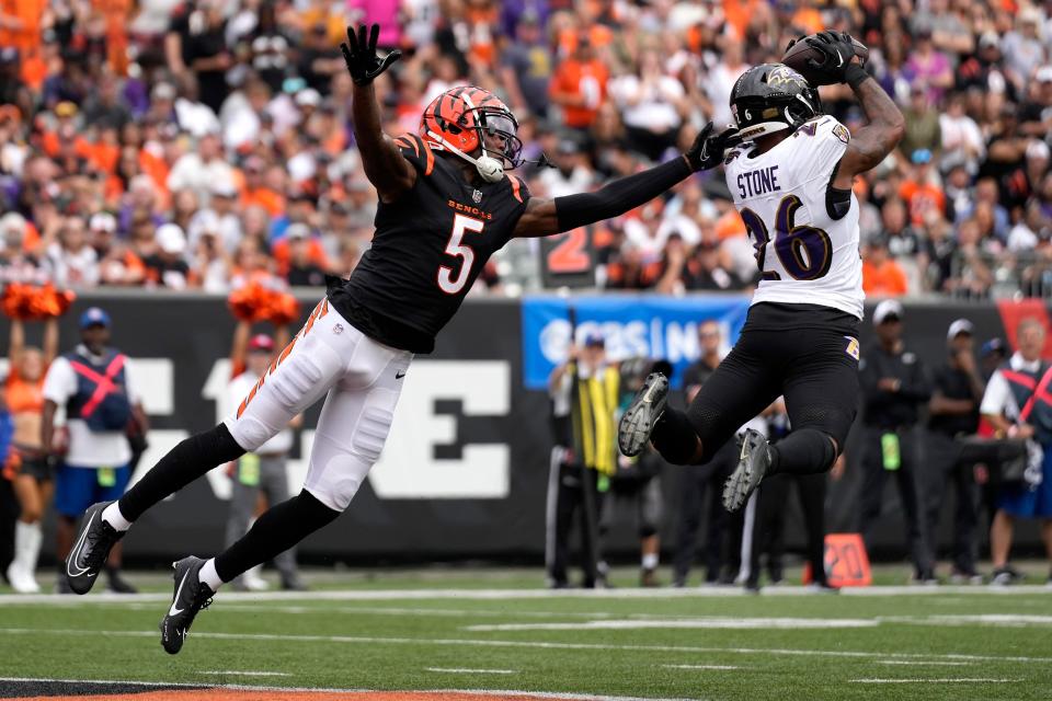 Baltimore Ravens safety Geno Stone (26) intercepts a pass intended for Cincinnati Bengals wide receiver <a class="link " href="https://sports.yahoo.com/nfl/players/32703" data-i13n="sec:content-canvas;subsec:anchor_text;elm:context_link" data-ylk="slk:Tee Higgins;sec:content-canvas;subsec:anchor_text;elm:context_link;itc:0">Tee Higgins</a> (5) in the third quarter of a Week 2 NFL football game between the Baltimore Ravens and the Cincinnati Bengals Sunday, Sept. 17, 2023, at Paycor Stadium in Cincinnati.