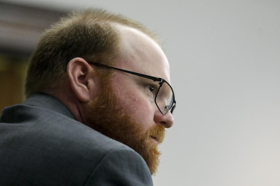 Defendant Travis McMichael looks on during during his trial at the Glynn County Courthouse, Friday, Nov. 19, 2021, in Brunswick, Ga. Greg McMichael and his son, Travis McMichael, and a neighbor, William "Roddie" Bryan are charged with the February 2020 slaying of 25-year-old Ahmaud Arbery. (Octavio Jones/Pool Photo via AP)