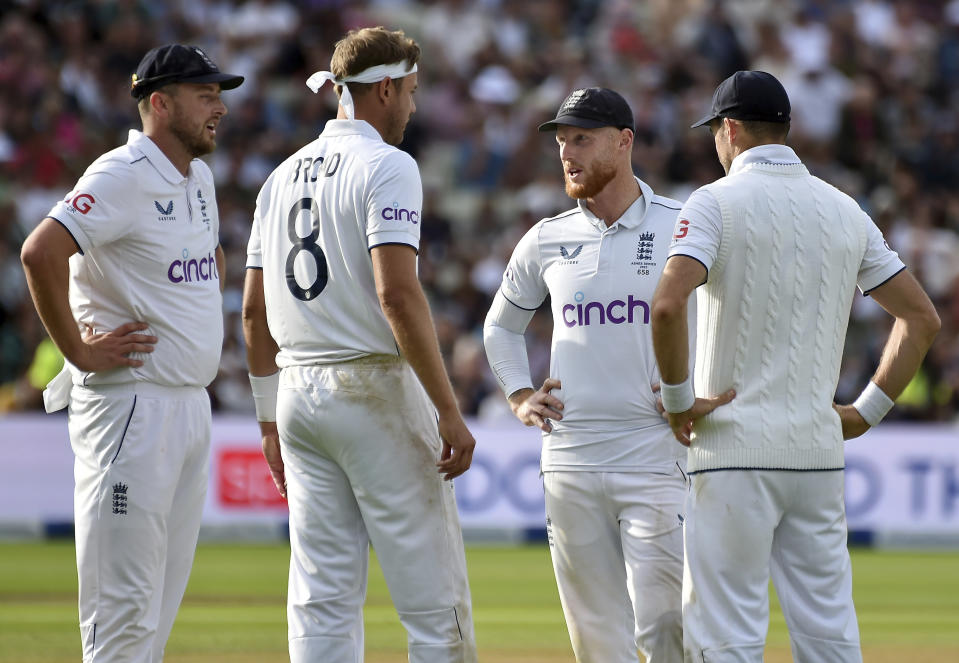 England's Ben Stokes, centre, speaks to England's Ollie Robinson, left, England's James Anderson, right, and England's Stuart Broad during day five of the first Ashes Test cricket match, at Edgbaston, Birmingham, England, Tuesday, June 20 2023. (AP Photo/Rui Vieira)