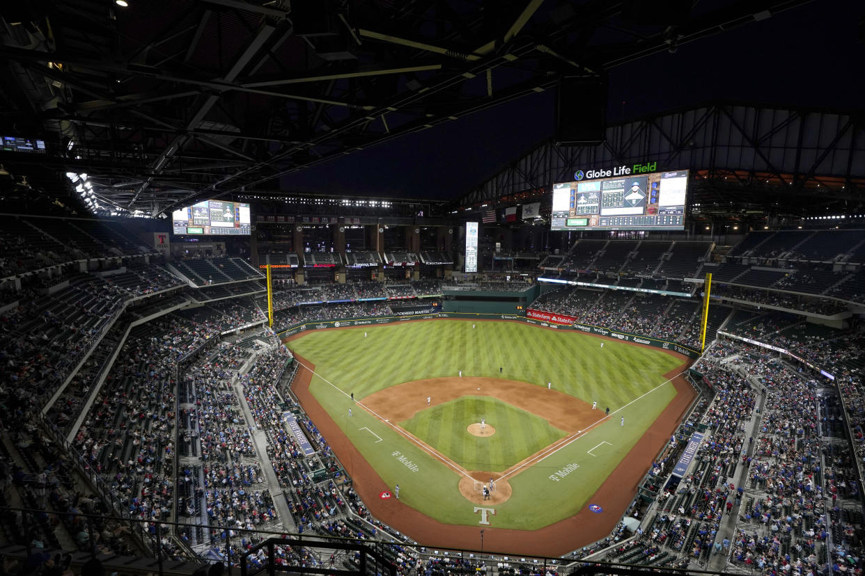 The Kansas City Royals and the Texas Rangers play in the sixth inning of a baseball game at Globe Life Field, Tuesday, April 11, 2023, in Arlington, Texas. (AP Photo/Tony Gutierrez)