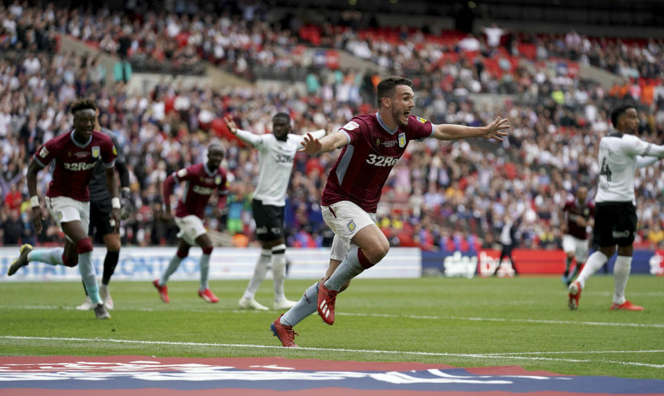 Aston Villa's John McGinn celebrates scoring his side's second goal of the game during the English Championship Play-off soccer final between Aston Villa and Derby County at Wembley Stadium, London, Monday, May 27, 2019. (Scott Wilson/PA via AP)