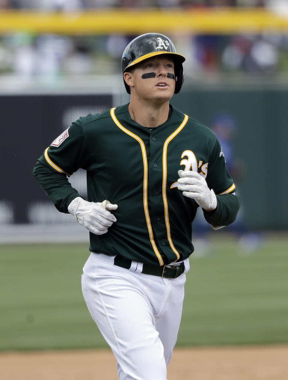 Oakland Athletics' Mike Hundley rounds the bases on his solo home run against the Chicago Cubs in the third inning of a spring training baseball game, Wednesday, March 13, 2019, in Mesa, Ariz. (AP Photo/Elaine Thompson)