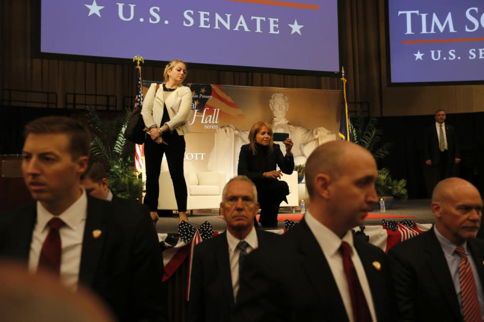 Katie Couric captures the scene; Secret Service in the foreground