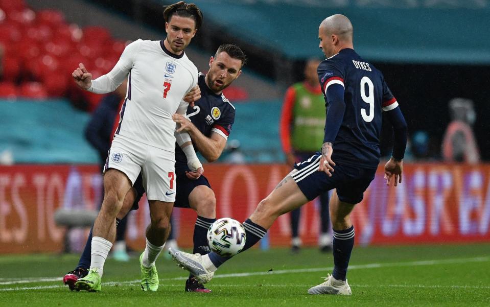 Stephen O'Donnell kees a close eye on Jack Grealish - AFP