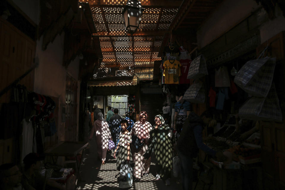 People walk through the ancient Medina of Fez, a UNESCO World Heritage Site, in Rabat, Morocco, Wednesday, May 22, 2019. (AP Photo/Mosa'ab Elshamy)