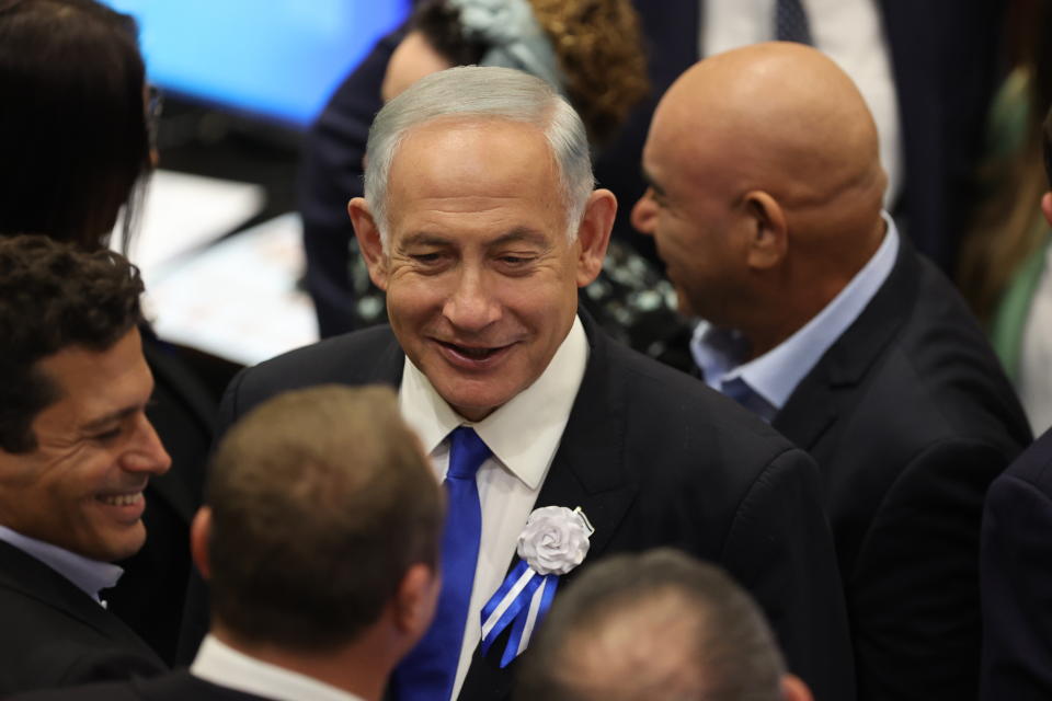 Israel's Likud Party leader Benjamin Netanyahu arrives during the swearing-in ceremony for Israeli lawmakers at the Knesset, Israel's parliament, in Jerusalem, Tuesday, Nov. 15, 2022. Israeli lawmakers were sworn in at the Knesset, on Tuesday, following national elections earlier this month. (Abir Sultan/Pool Photo via AP)