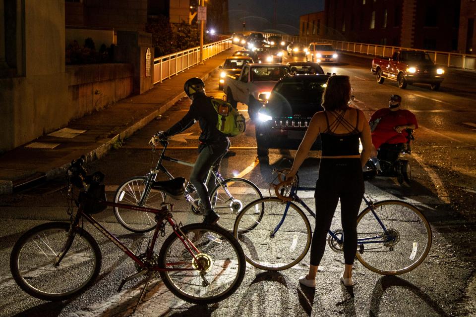 Protesters temporarily block Second Street bridge traffic as they make their way down Main Street during a peaceful protest Tuesday evening. Tuesday marked the 20th straight day of protest in Louisville. June 16, 2020