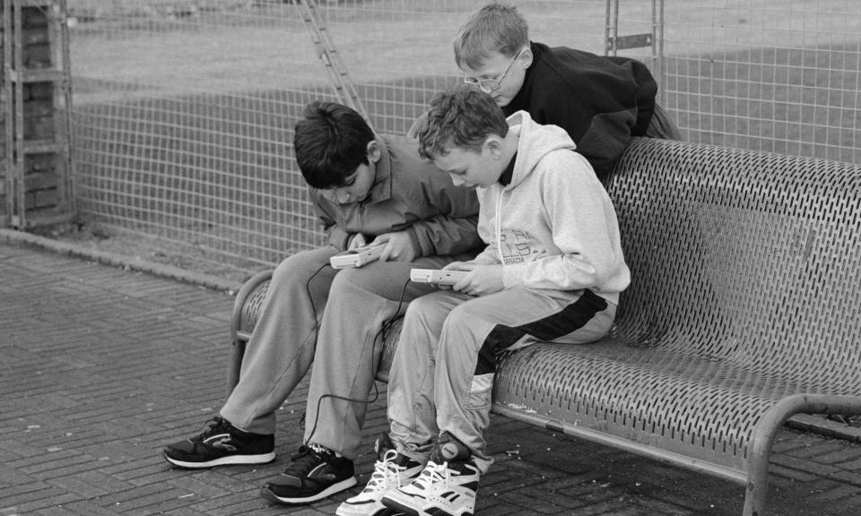 <span>The first generation … kids playing the OG Game Boy in 1989.</span><span>Photograph: Derek Copland/Alamy</span>