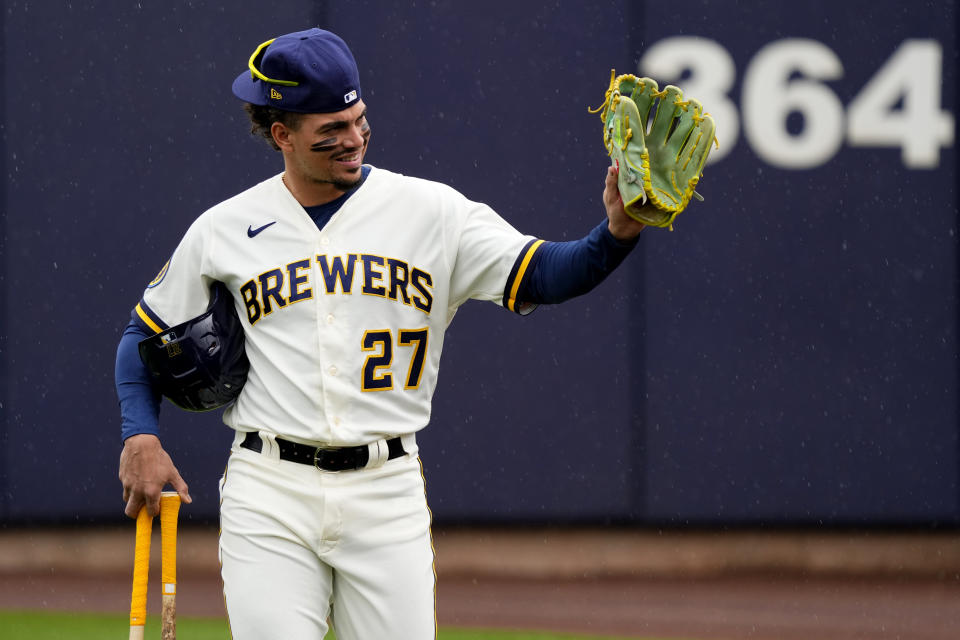 Milwaukee Brewers' Willy Adames waves to fans as he arrives prior to a spring training baseball game against the Chicago White Sox, Tuesday, March 21, 2023, in Phoenix. (AP Photo/Matt York)