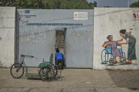 Paul Mitemberezi, a market vendor who has been disabled since he was 3 because of polio, arrives at the North Kivu Paralympic League to play basketball, in Goma, democratic Republic of Congo, Tuesday Jan. 17, 2023. When Pope Francis arrives in Congo and South Sudan Jan. 31, thousands of people will take special note of a gesture more grounded than the sign of the cross. Watching from their wheelchairs, they will relate to the way he uses his. (AP Photo/Moses Sawasawa)