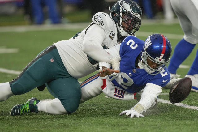 Philadelphia Eagles offensive tackle Lane Johnson (65) walks off the field  against the New York Giants during an NFL football game Sunday, Dec. 11,  2022, in East Rutherford, N.J. (AP Photo/Adam Hunger