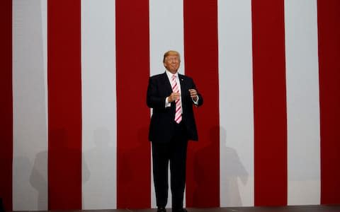 President Donald Trump arrives for a campaign rally for U.S. Senate candidate Luther Strang - Credit: Evan Vucci/AP