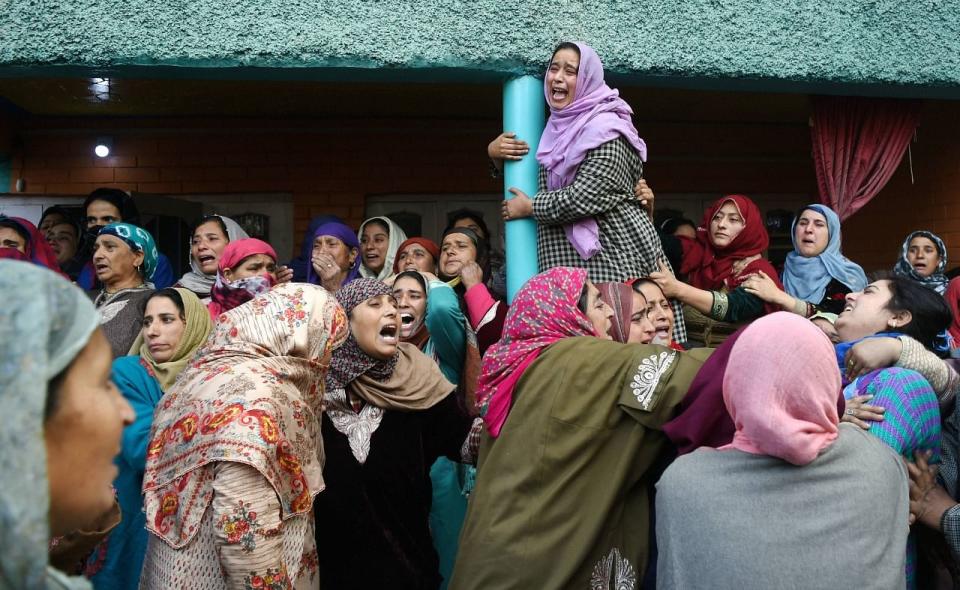 Relatives and other women mourn as they attend the funeral of Bharatiya Janata Yuva Morcha leader Fida Hussain Itoo, who was killed along with two other leaders in a suspected militant attack last night, at YK Pora in Kulgam District of south Kashmir, Friday, 30 October.