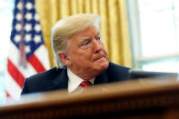 U.S. President Donald Trump speaks with workers on "Cutting the Red Tape, Unleashing Economic Freedom" in the Oval Office of the White House in Washington, U.S., October 17, 2018. REUTERS/Joshua Roberts 