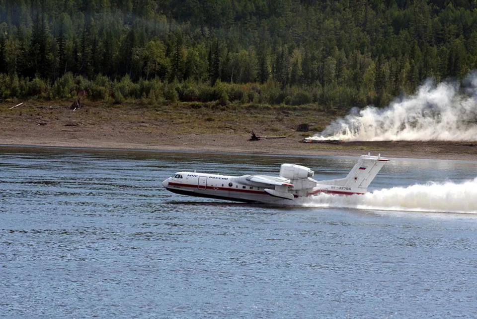 FILE - In this file photo taken from video released on Sunday, July 18, 2021 by Russian Emergency Situations Ministry press service, a Russian Emergency Ministry's Beriev multipurpose amphibious aircraft Be-200 takes-off to drop water during extinguishing a forest fire in the republic of Sakha also knows as Yakutia, Russia Far East. Russia has been plagued by widespread forest fires, blamed on unusually high temperatures and the neglect of fire safety rules, with Sakha-Yakutia in northeastern Siberia being the worst affected region lately. Each year, thousands of wildfires engulf wide swathes of Russia, destroying forests and shrouding broad territories in acrid smoke. This summer has seen particularly massive fires in Yakutia in northeastern Siberia following unprecedented heat. (Russian Emergency Situations Ministry press service via AP, File)