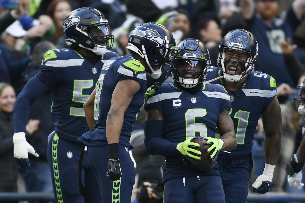 Seahawks LB Darrell Taylor runs onto the field after an