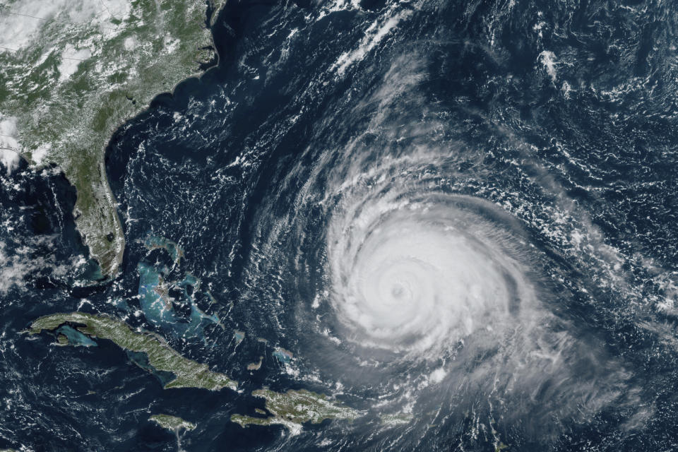 In this satellite image provided by the National Oceanographic and Atmospheric Administration via NASA, Hurricane Lee continues its slow west-northwest trajectory across the Atlantic Ocean on Tuesday, Sept. 12, 2023. (NOAA/NASA via AP)