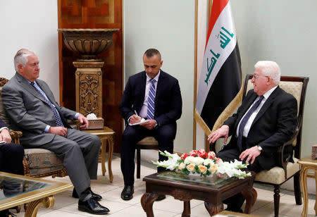 U.S. Secretary of State Rex Tillerson (L) listens as Iraq's President Fuad Masum (R) speaks during their meeting in Baghdad, Iraq October 23, 2017. REUTERS/Alex Brandon/Pool