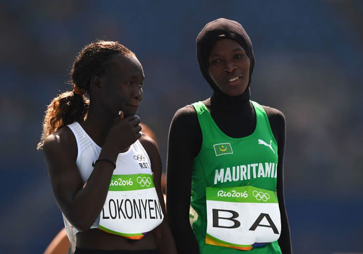 RIO DE JANEIRO, BRAZIL - AUGUST 17: Rose Nathike Lokonyen of Refugee Olympic Team and Houleye Ba of Mauritania in discussion prior to the Women's 800 metres heats on Day 12 of the Rio 2016 Olympic Games at the Olympic Stadium on August 17, 2016 in Rio de Janeiro, Brazil. (Photo by Shaun Botterill/Getty Images)