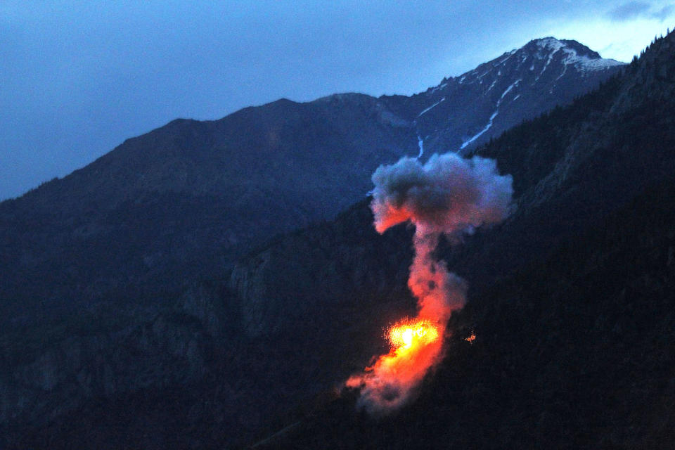 <p>Two 500 pound bombs explode at dusk on a Taliban fighting position near Blocking Position one above Kamdesh in Afghanistan’s Nuristan Province, on June 11, 2012. (Photo: Tim Wimborne/Reuters) </p>