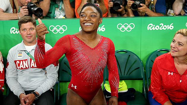 Simone Biles became the first American woman to win the Olympic vault title and the first to win three gold at the same Games.