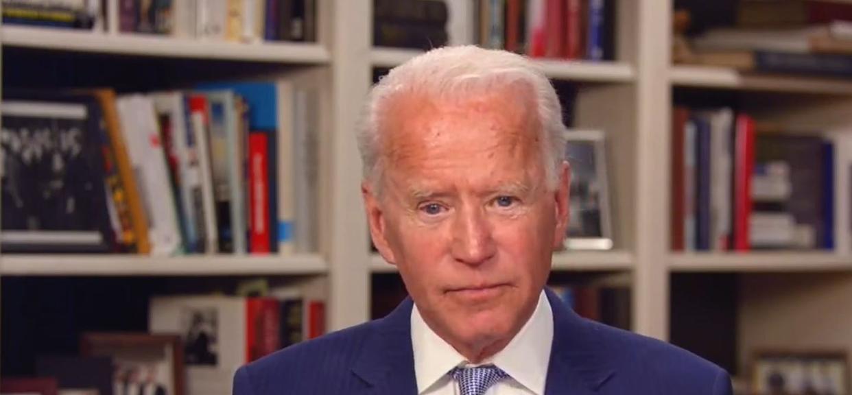 <span class="caption">Joe Biden's basement bookshelf has become a familiar background for his campaign videos.</span> <span class="attribution"><a class="link " href="https://www.gettyimages.com/detail/news-photo/in-this-screengrab-from-joebiden-com-democratic-news-photo/1209520025" rel="nofollow noopener" target="_blank" data-ylk="slk:Photo by JoeBiden.com via Getty Images;elm:context_link;itc:0;sec:content-canvas">Photo by JoeBiden.com via Getty Images</a></span>