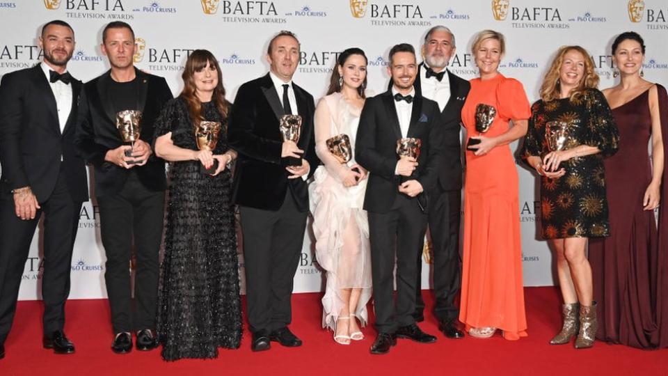 (L to R) Matt Willis, Scott Mills, Suzy Lamb, Andrew Cartmell, Julia Sanina, Lee Smithurst, James O'Brien, Lisa McCormack, Nikki Parsons and Emma Willis, accepting the Live Event Coverage Award for 'Eurovision Song Contest 2023'.